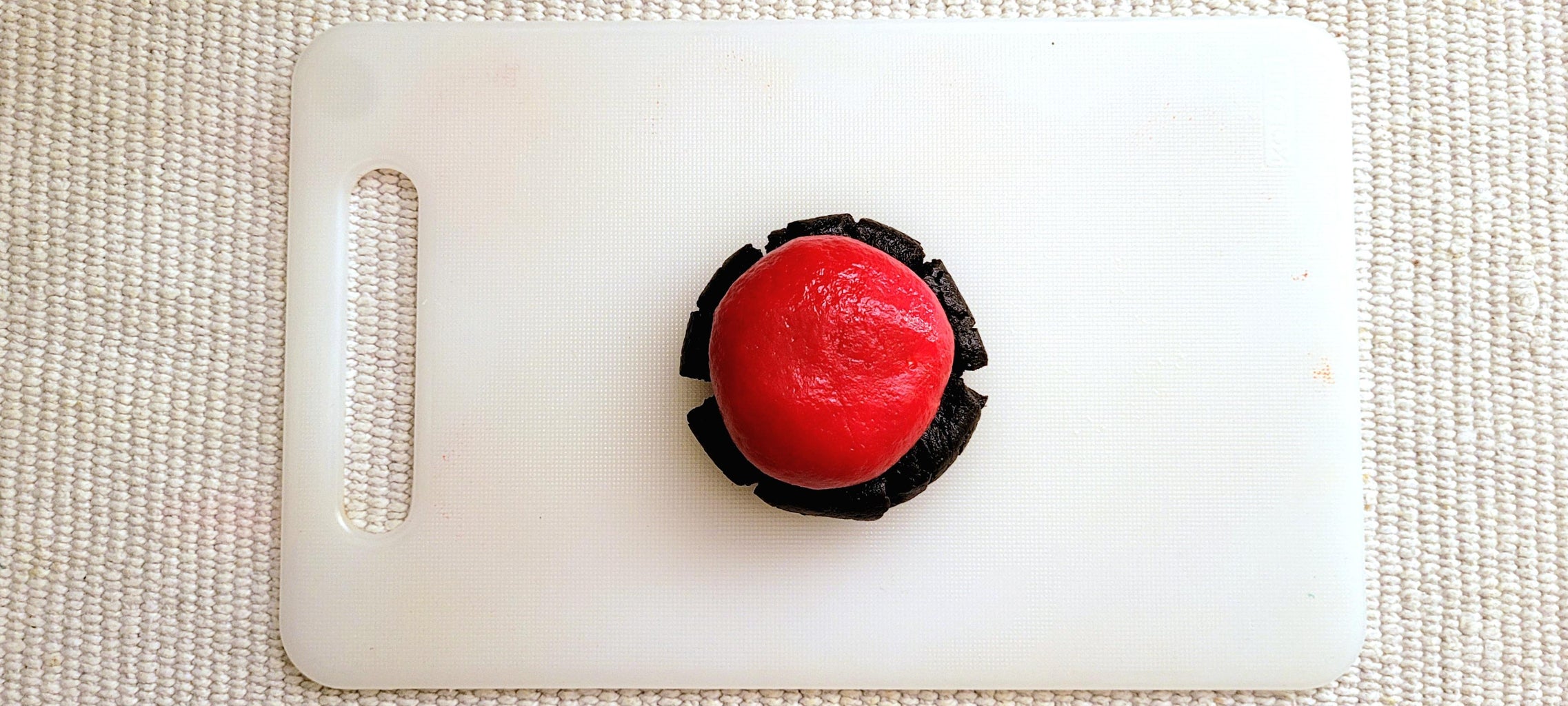 Wrapping the Red Dough Ball With Black Dough